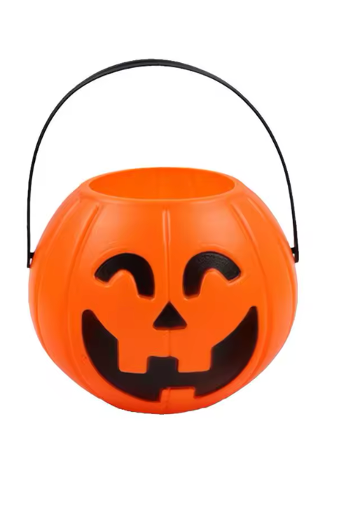 An orange jack-o'-lantern trick-or-treat bucket with a carved smiling face and black carry handle