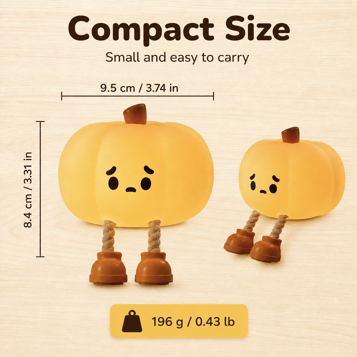 A product listing graphic showing two cute pumpkin-shaped figurines on a light wood background with text reading 'Compact Size' and dimensions/weight. The main product is a small yellow-orange pumpkin with a sad face, rope legs, and brown bell-shaped feet.