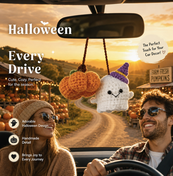 Ghost and pumpkin charms hanging from the rearview mirror on a country drive