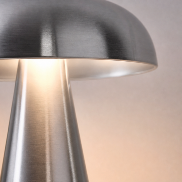 Silver mushroom lamp, close-up of the glowing shade