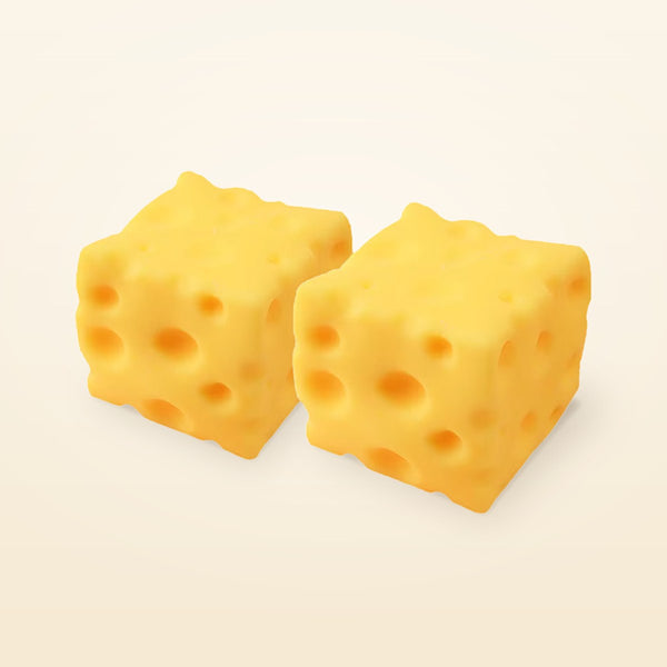 A set of two yellow cheese squishy cubes side by side on a cream background