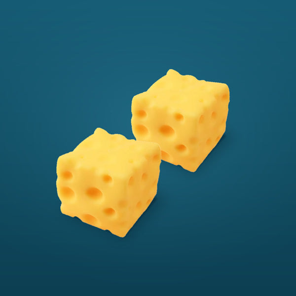 Two yellow cheese squishy cubes on a deep teal background
