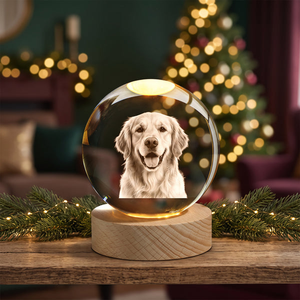 A smiling golden retriever engraved inside a glowing crystal ball on a wooden shelf with a pine garland (example engraving).