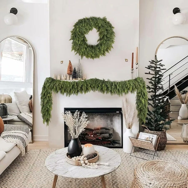 Faux cypress garland on a white living-room mantel; wreath shown is not included (supplier photo)