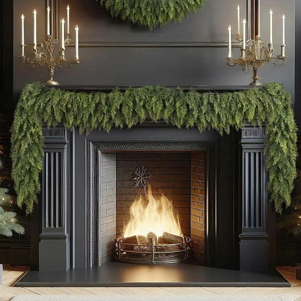 Faux cypress garland draped on a dark fireplace mantel (supplier photo)