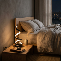 Helix spiral lamp on a bedside table at night