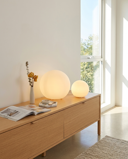 Sfera ball lamps in two sizes on a console table
