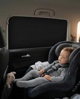 Toddler napping beside a fully covered window with Scudo