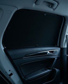 Ombra fully opaque matte black shade covering a car side window