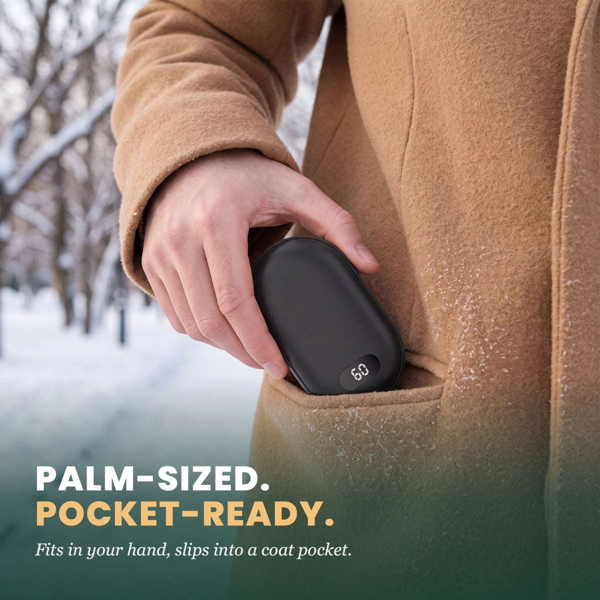 Palm-sized and pocket-ready: slipping the black hand warmer into a wool coat pocket