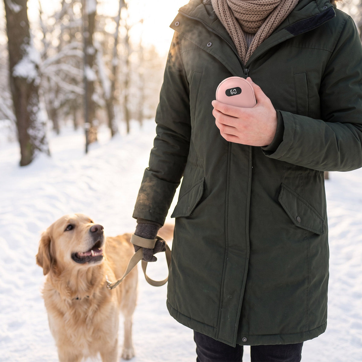 Holding the pink hand warmer on a snowy dog walk